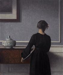 Interior with Young Woman from Behind - Вільгельм Хаммерсхьой